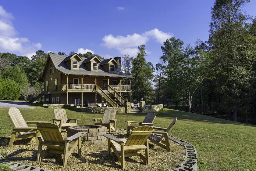 Large authentic 3-story log cabin adjacent to lake - Image 1