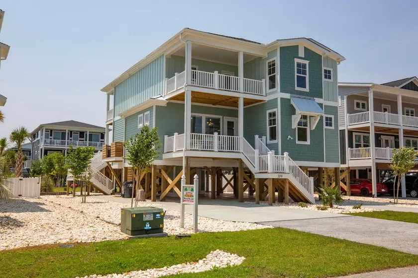 Sally's Sandcastle in Oak Island boasts 7 bedrooms, ocean views, and a private pool. - Image 1