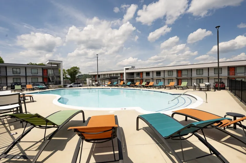 Luxury 1BR Condo: OPEN Pool + Prime Location - Image 1
