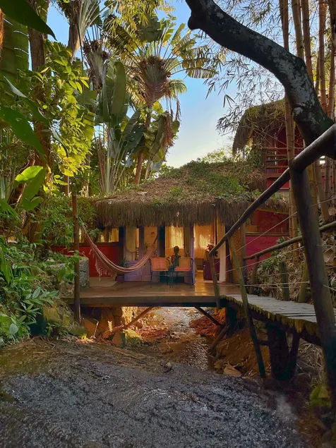 House suspended over the waterfall in paradise - Image 1