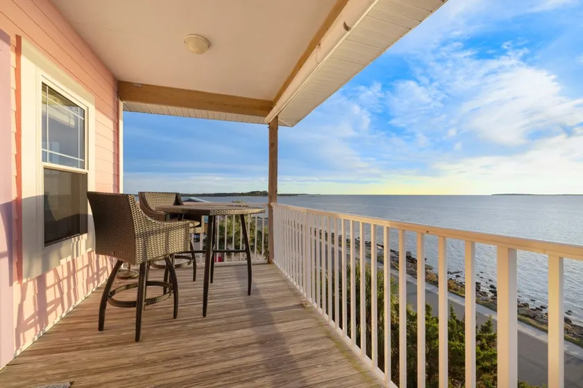 Coastal stilt house on the water - Image 1