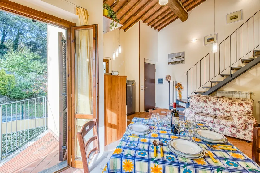 Tuscan Sun Duplex with Balcony and Shared Pool - Happy Rentals - Image 1