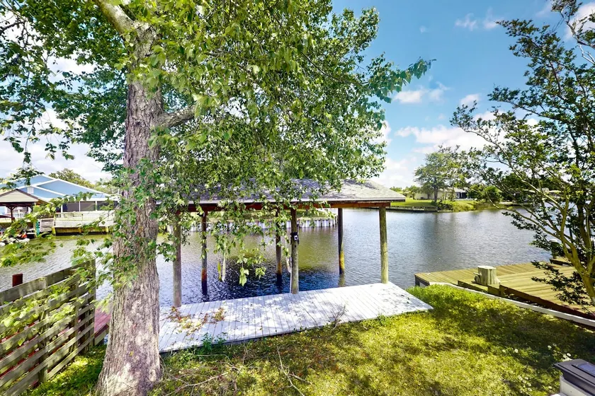 Two-story 3BR waterfront retreat with a deck - Image 1