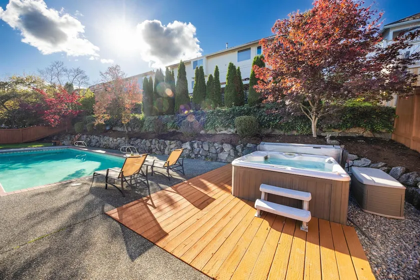 Stylish 4BR retreat with pool & year-round hot tub - Image 1