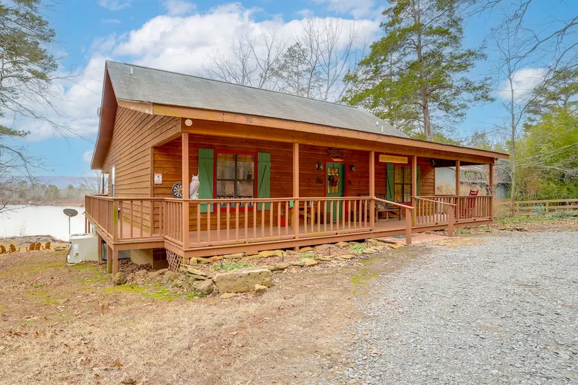 Deck & Fire Pit: Waterfront Cabin in Greers Ferry! - Image 1