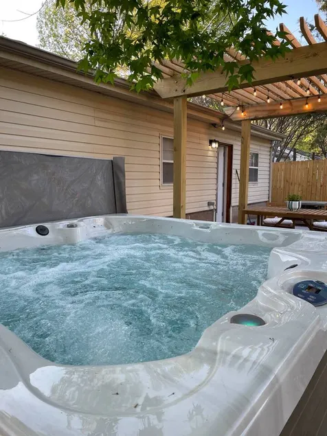 Cozy home near the Gathering Place with a hot tub - Image 1
