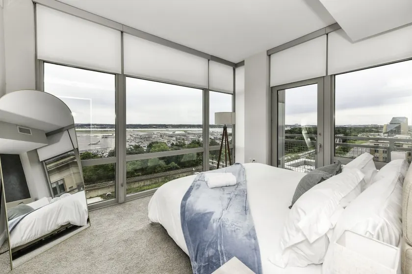 Modern 2BR Escape with Gym, Parking & Airport View - Image 1