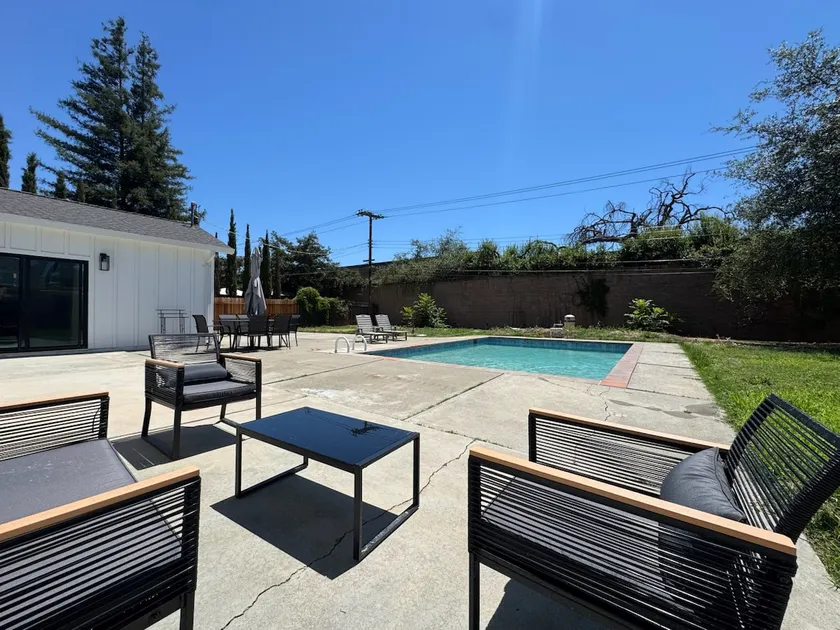 Pool · Fenced Yard · Garage · Tree-Lined Street - Image 1