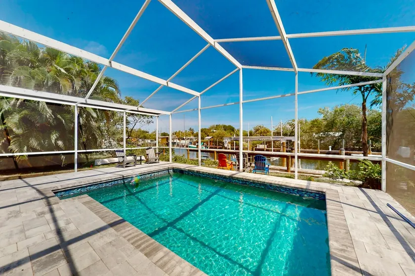Sunny canal front home with a pool & dock - centra - Image 1
