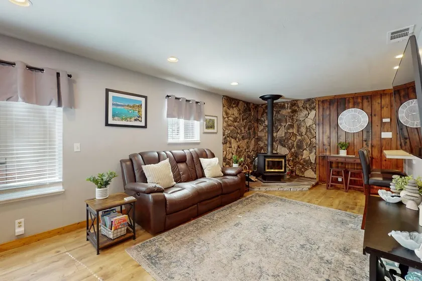 Conveniently located with large deck & fireplace - - Image 1