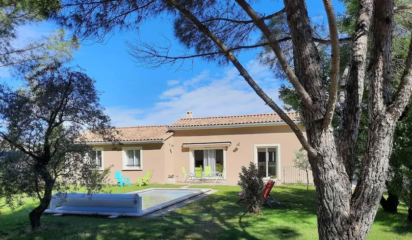 a pretty family house with a heated pool and a pre - Image 1