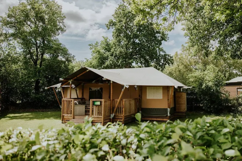 Glamping under canvas with a unique indoor play area featuring a slide. Great for adventurous families wanting to combine comfort with that outdoor feeling. - Image 1