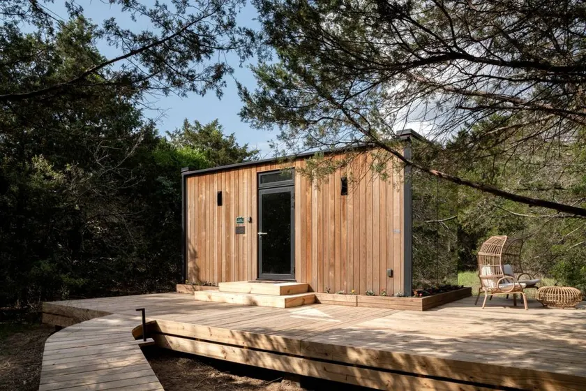 Whimsical Flower-Inspired Mirror Cabin by the Lake in the Enchanted Forests of Texas - Image 1