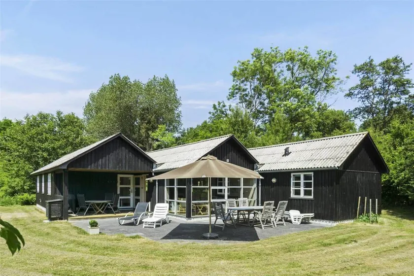 Family-oriented holiday home with jacuzzi, sauna & terrace | Next to the beach - Image 1
