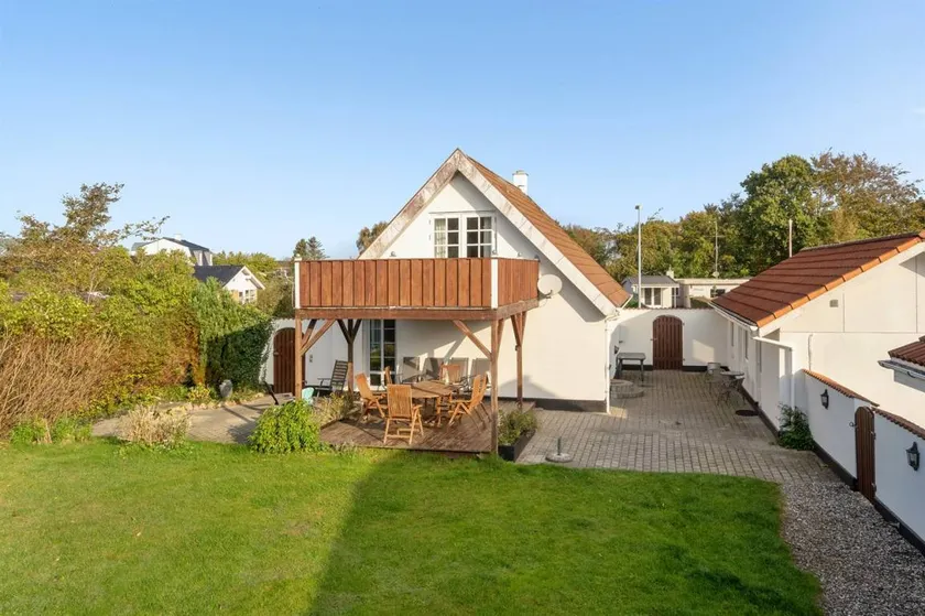 Holiday home with terrace, hot tub & garden | Sea view - Image 1