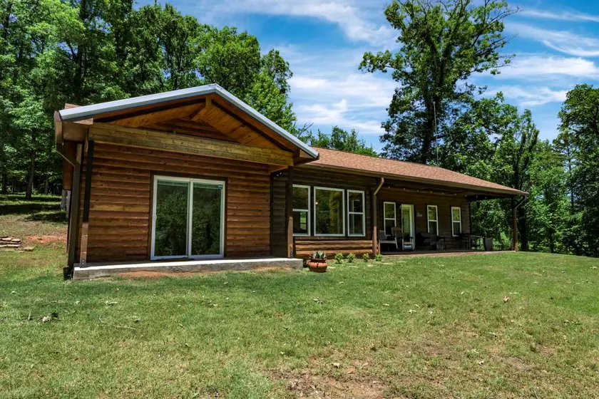 Enchanting Riverside Cabin Retreat with Mountain Views near Sardis Lake Oklahoma - Image 1