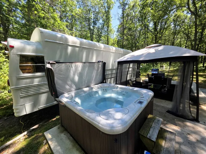 Rustic Converted School Bus with Outdoor Shower Near ORV Trails in Manistee National Forest, Michigan - Image 1