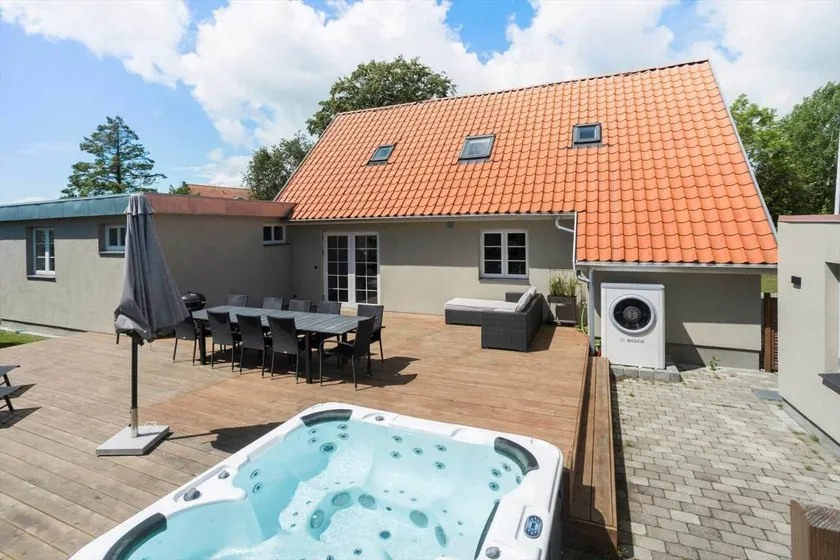Holiday home with terrace, sauna & hot tub | Next to the beach - Image 1