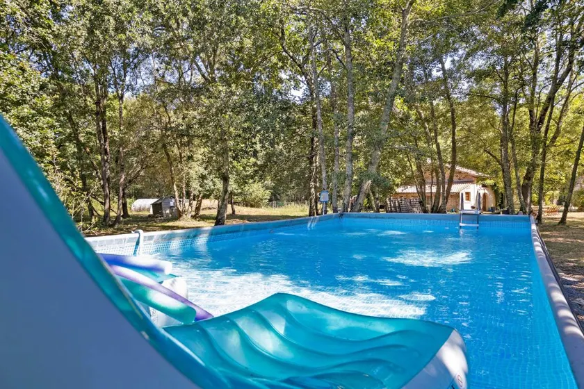 Holiday home with BBQ, terrace & pool | Garden view - Image 1