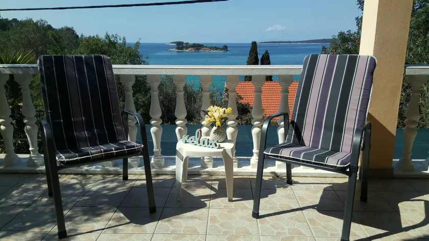 Pleasant holiday apartment with private pool, terrace & barbeque | Sea view - Image 1