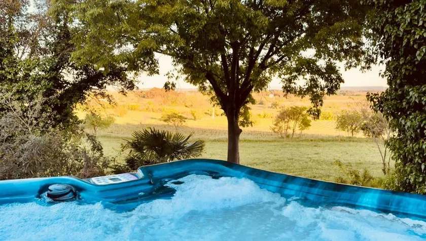 Holiday home with barbeque, garden & hot tub | Garden view | Suitable for remote work - Image 1