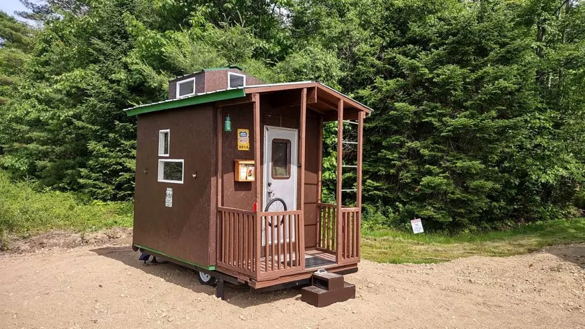 Whimsical Caboose Glamping Cabin with SpookyWoods Trail Near Penobscot River Lincoln, Maine - Image 1