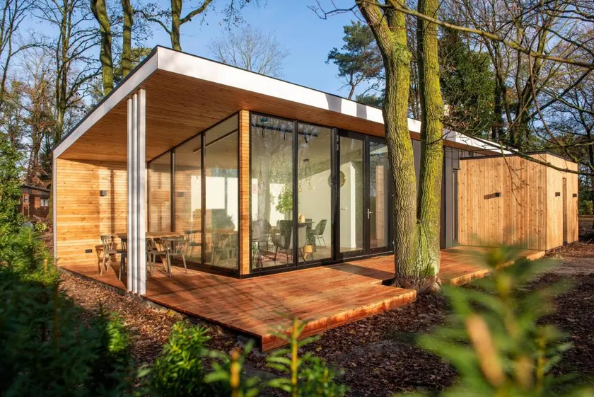 Wellness cottage with private sauna and hot tub for relaxing days surrounded by forest. - Image 1