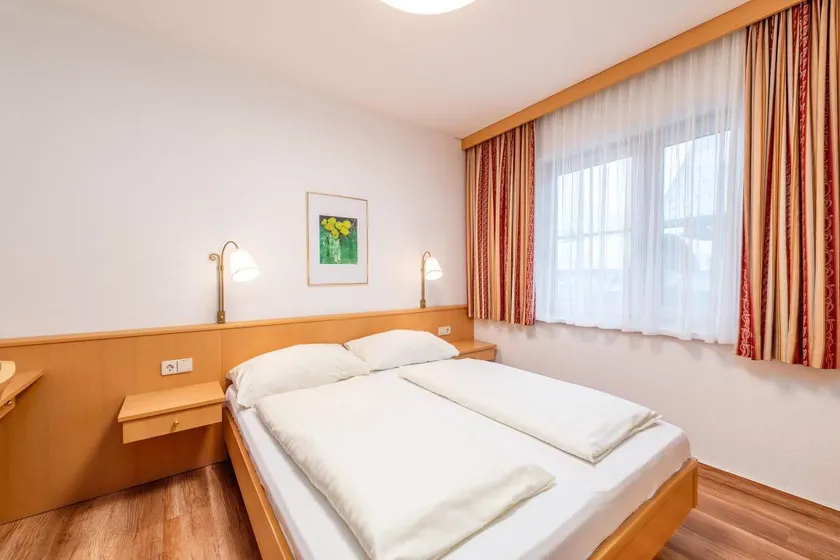 Children-friendly charming holiday apartment with sauna, pool & garden | Garden view - Image 1