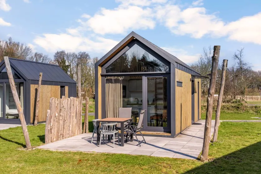Cozy tiny house nestled among the trees or by the fishing pond for a wonderful family holiday full of adventure and relaxation. - Image 1