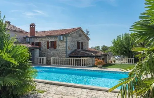 Four-Bedroom Holiday House Maria Nora with Pool - Image 1