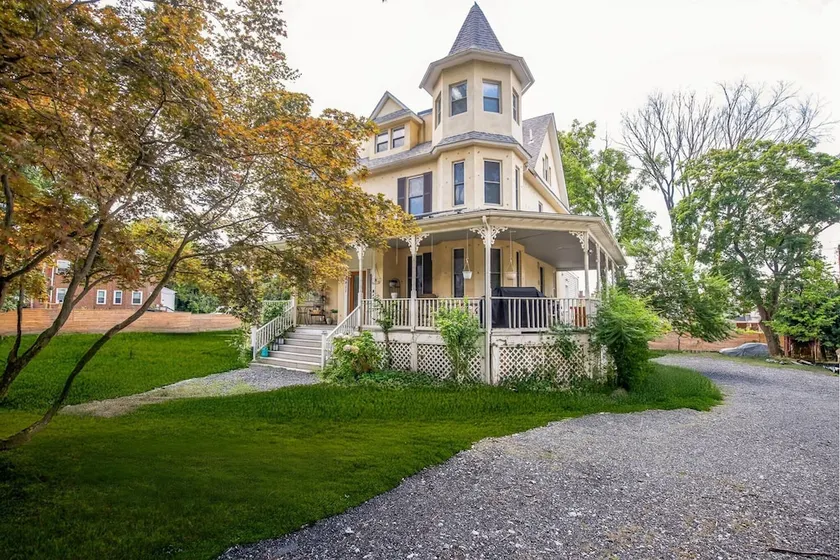 Charming Victorian Home with Porch & Large Yard home - Image 1