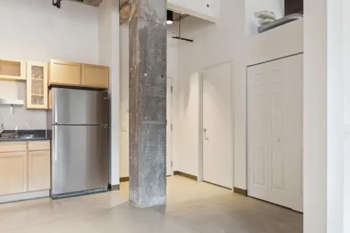 2BR Historic Loft Retreat With Pool & Gym - Image 1