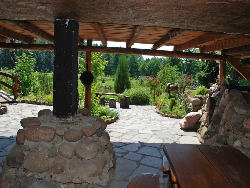 Rustic Riverside Cabin in Forest - Image 1