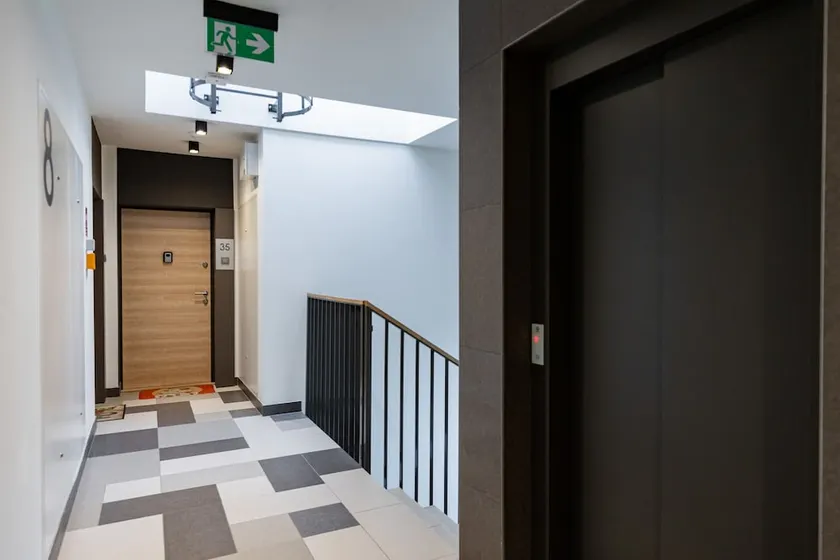 Industrial Bemowo Apartment by Renters - Image 1