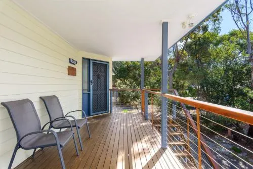 12 Ibis Court Highset Beach House With Natural Bushland Gardens And Covered Decks - Image 1