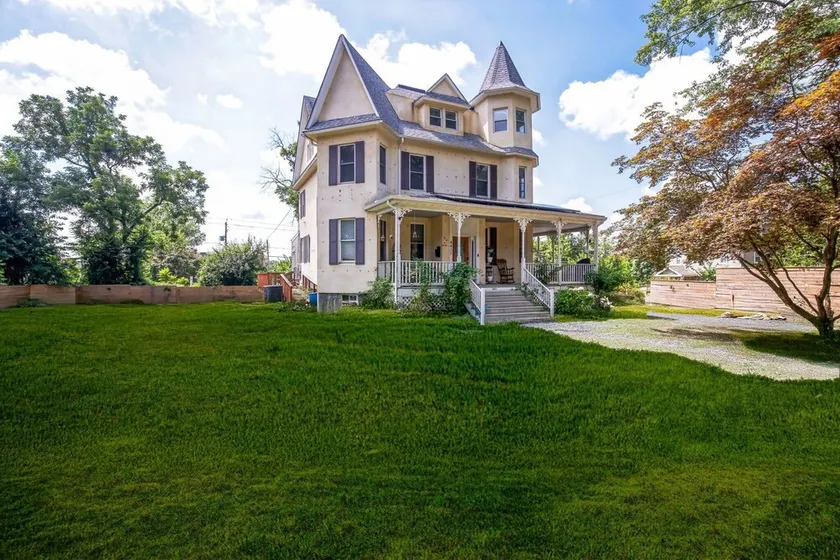 Charming Victorian Home With Porch & Large Yard 7 Bedroom Home - Image 1