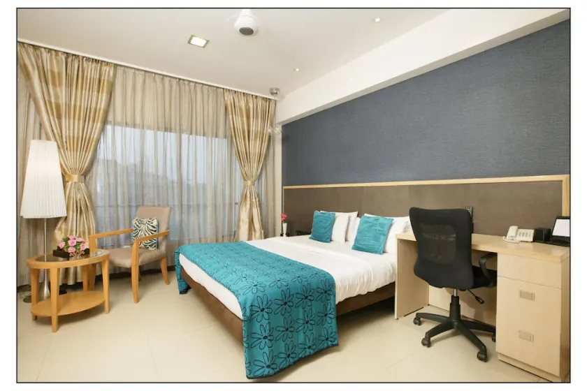 Capital O 697 The Sirona Hotel - Image 1