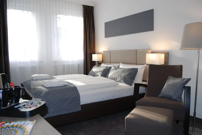 Dom Hotel Am Römerbrunnen - Image 1