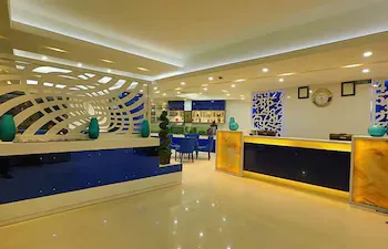 City Hotel And Suites - Image 1