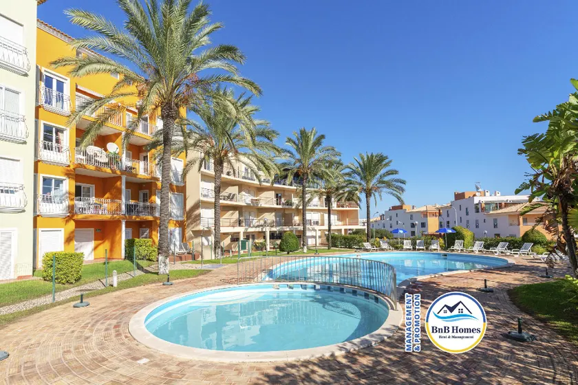 BnB Homes Apartment with cozy Terrace & 2 Swimming pools near the heart city - Image 1
