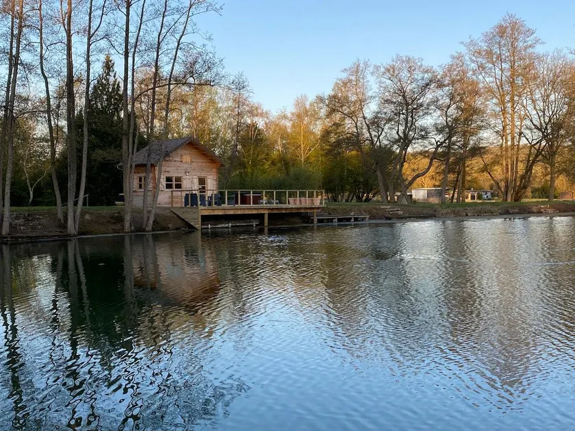 Chalet with a hot tub and terrace above the water - Image 1