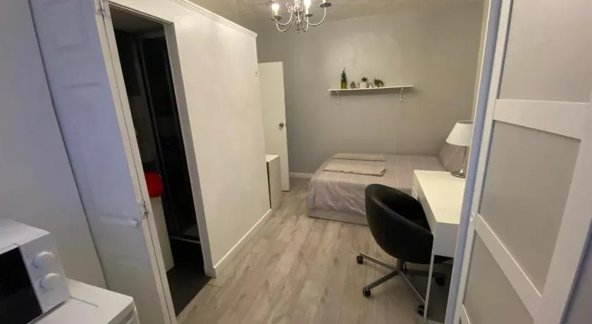 Modern bedroom with garden view - Image 1