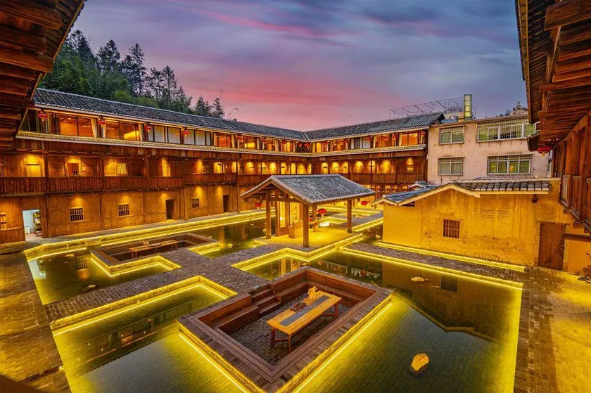 Yongding Earth Building Duilu · Shengheng Building World Heritage Home Stay - Image 1