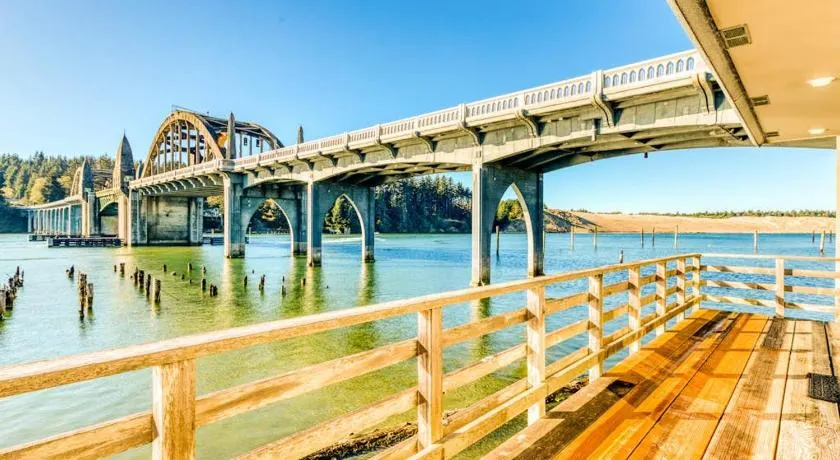 Incredible Riverfront Oasis with Wraparound Deck & Cozy Interior - Image 1