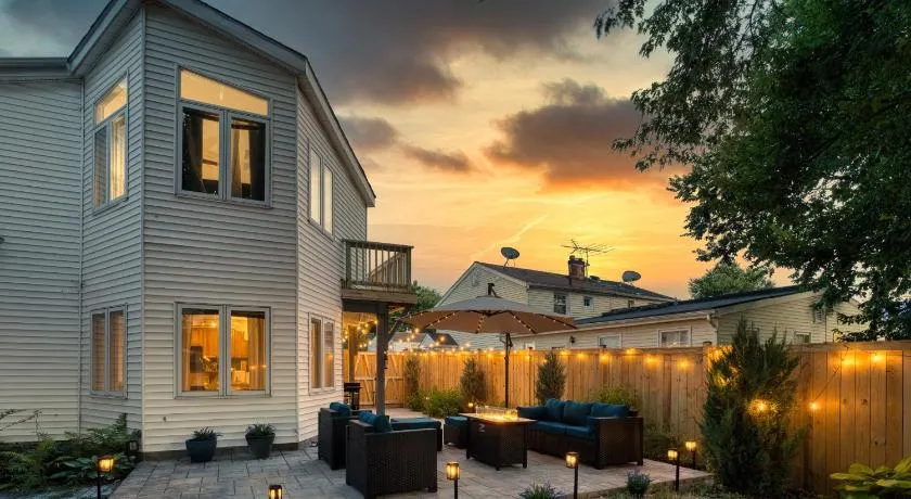 Patio Paradise Stylish 3BR Home with Gaming Room - Image 1