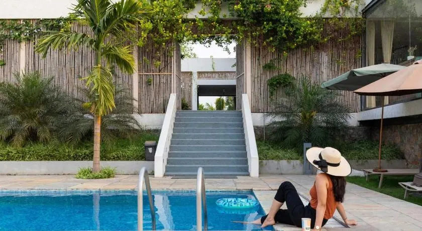Open House by StayVista - Nestled in nature, featuring a Swimming pool & Expansive lawn for a serene retreat - Image 1