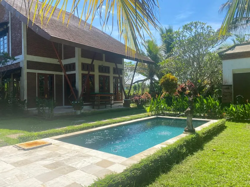 A cozy residence for an extended family in a peaceful rice field setting - Image 1