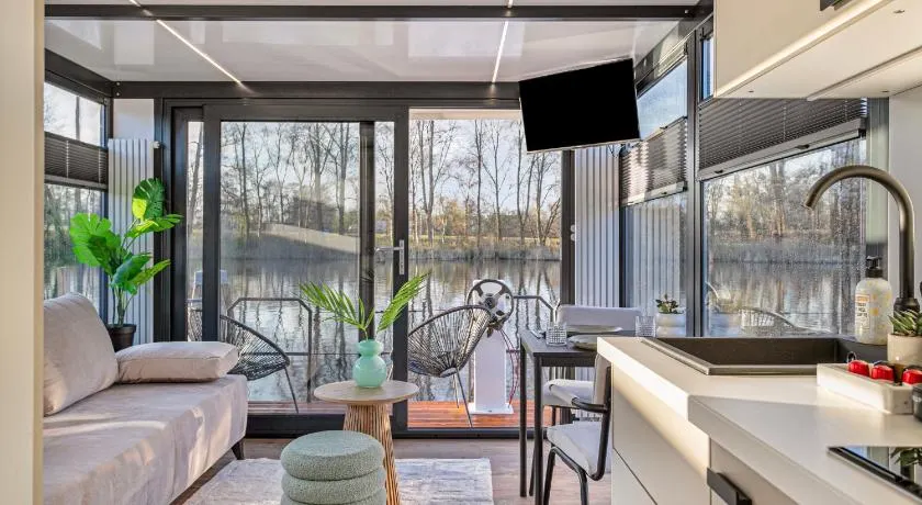 Charming Tiny Houseboat Escape Near Amsterdam by Weltevreden Experience - Image 1