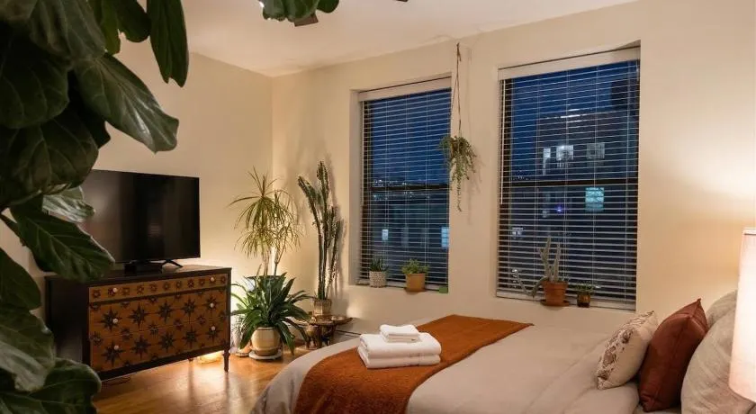 Sunlit Luxury 2BR Harlem Brownstone Retreat - Near Express Trains - Image 1