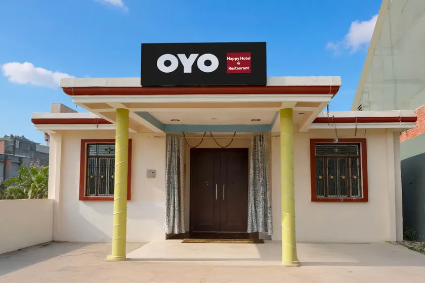 Hotel O by OYO Happy Hotel & Restaurant - Image 1